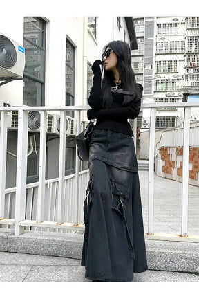 Siyah kot kumaştan yapılmış A kesim etek modeli.