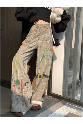 Karalama Rüyalar Ekoseli Pantolon, modern desenlerle enerjik bir görünüm.