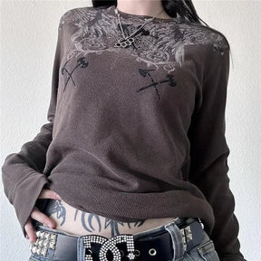 Grunge tarzda melek figürü bulunan waffle desenli üst.