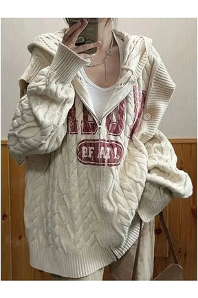 Vintage tarzda düşük omuz detayı ve fermuarı olan örgü kazak.