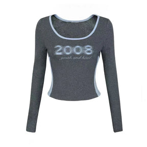 Y2K Grafik Kontrast Biye üst, modern desenlerle canlı renk kontrastı sunar.